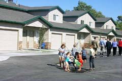 Photo 3: Children playing, HUD and county officials touring Campbell Court]