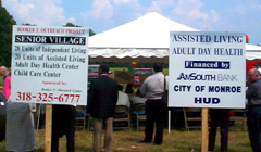 [Photo 2: Two posters with information about the assisted living/adult day care program]