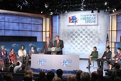 [Photo: President Bush and Secretary Martinez stand before an audience at the White House Conference on Minority Homeownership.]
