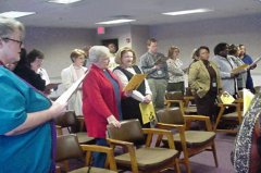 [Photo 3:  The audience all sang together at the ceremony]