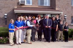 [Photo 2: Ribbon cutting ceremony]