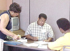 [Photo 1:  NLIP volunteers assisting a homeless client]