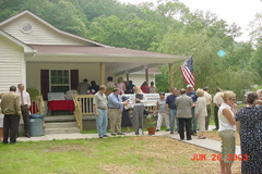 [Photo 2: Cleveland and Elsie Asher welcome visitors to their new home