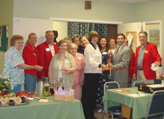 [Photo 2: Residents at the Sandstone Foothills Apartments attending the Ribon cutting ceremony]