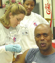 [Photo 1: Guster Hunter getting flu shot]