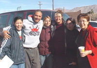 [Photo 3: HUD representative, partners, and volunteers]