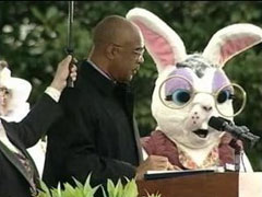 [Photo 1: Secretary Paige with the Easter Bunny at the podium]