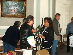 [Photo: Jo Baylor listens to input from a Gulf Coast developer]
