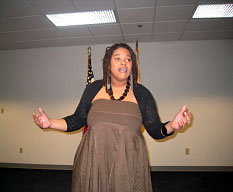 [Photo 2: Tameka Barnette performing]