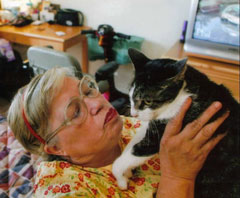  [Photo 1:  Jackie Clark and her cat, No-No at home in Des Moines, Iowa]