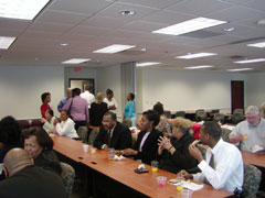 [Photo 2: Employees eating breakfast]