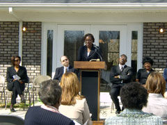 [Photo 1: Ms. Julia Moss thanking partners]