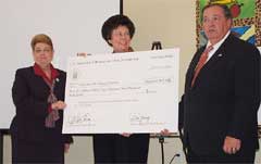 [Photo: Secretary Hadi with the ceremonial check]