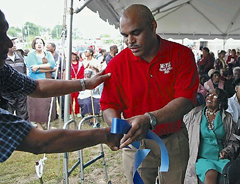 [Photo 1:  LeRoy Thompson at the ceremonial ribbon-cutting]