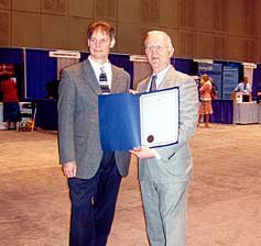 [Photo 2: Louis M. Berra and Michael DeVos]