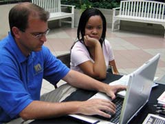 [Photo: Accent Mortgage Company representative with participant]