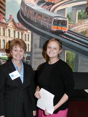 [Photo 1: People posing in front of the Energy Star promotion]