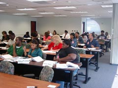 [Photo 1: Federal Employees viewing the HELP presentation]