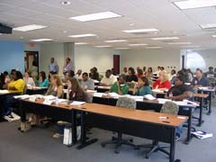 [Photo 2: Federal Employees viewing the HELP presentation]