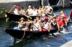 [Photo 2: Tribal Canoe Journey participants in their canoes]