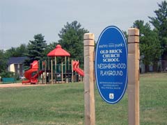 [Photo 3: School playground]