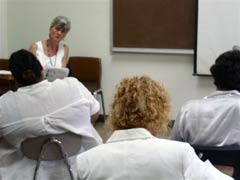 [Photo 3: "HUD At A Glance" presentation]