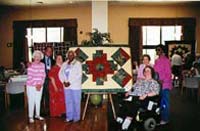 [Photo 1: Allied Jewish quilters (l-r) Celia Cohen, Mathew Frances (computer teacher), Rochelle Oganz, Naomi Hill, Sherri Kraut (seated), Jane Draine, Lavon Moore]