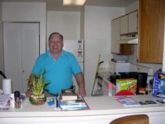 [Photo 2: David Stamps in his kitchen]