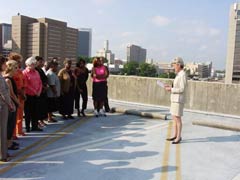 [Photo: Birmingham HUD Field Office workers in a moment of silence]
