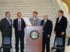 [Photo 1: (L to R) Assistant Secretary Cabrera, Mike Stalvey, Mike Beatty, Boyce Norris, Jr., and Bob Young.]