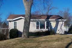 [Photo 1: Repaired Home]