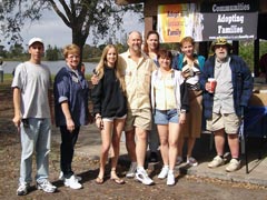 [Photo: Vanderlaan family with volunteers]