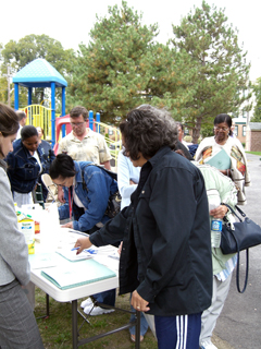 [Photo: Residents pledging]
