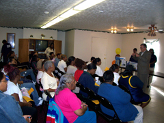 [Photo 1: MF Director Will Sly addressing the attendees]