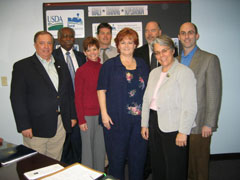 [Photo: Left to right - Nicholas Shelley; Ferdinand R. Juluke, Jr.; Vicki Robinson; Matthew Stewart; Elizabeth Whittaker; Gary Causey; Nancy Muller; Steve Auger]