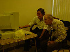 [Photo 1: Resident learning computer basics]