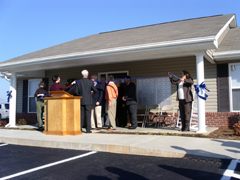 [Photo 2: Group cutting ribbon]