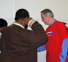 [Photo 2: Mayor Peterson and homeless neighbors]