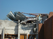 [Photo 4: Damage to the school's roof]