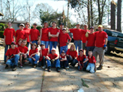 [Photo 12: Scouts and family members that worked to remove trees and debris from property]