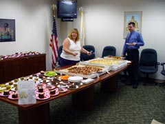 [Photo 1: Michele Bernier and Alex Vilardo setting table]
