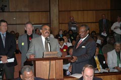 [Photo 2: Harold Cole speaking]