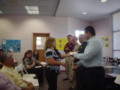 [Photo 1: Dean Stephen Roeder and Frank Riley look on as the Certificates of Achievement are awarded]