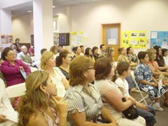 [Photo 4: Students and their families]