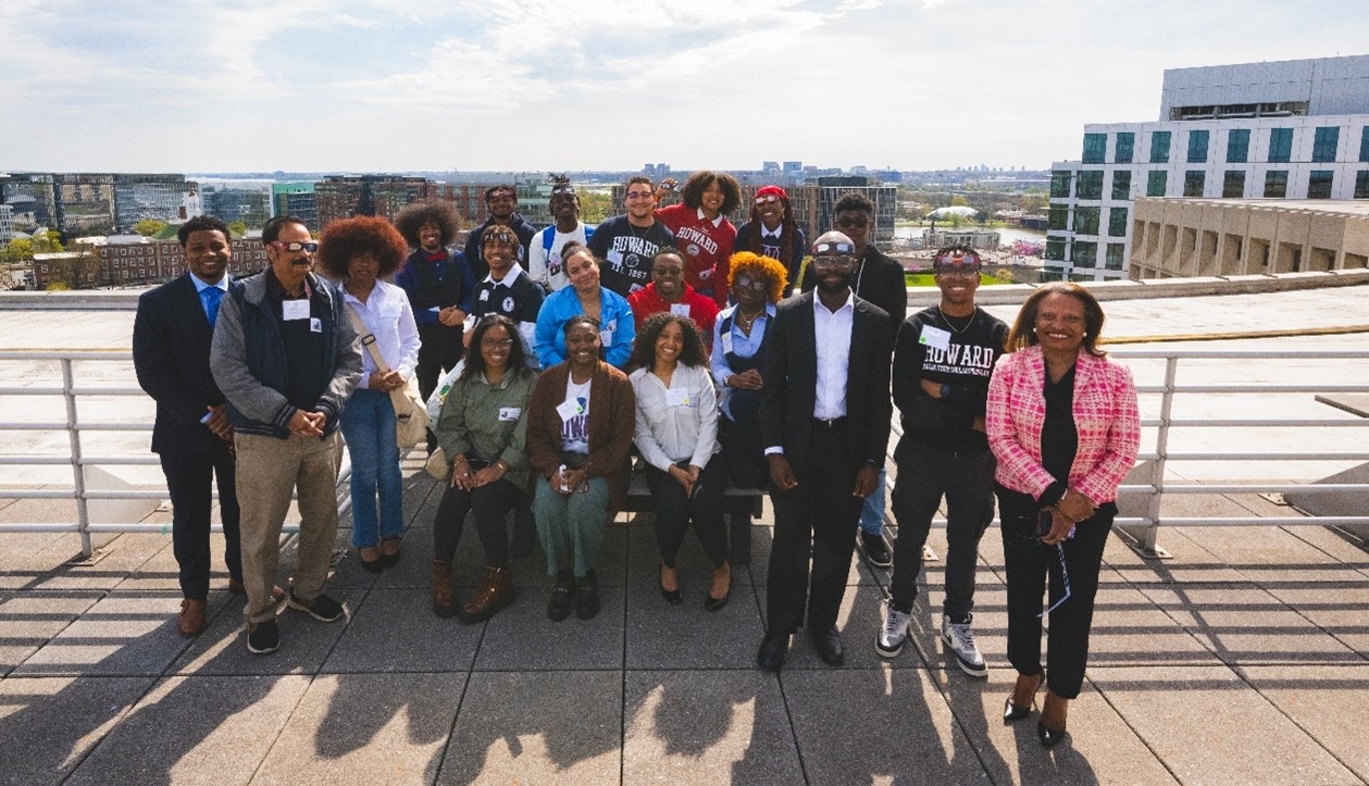 Acting Secretary Todman prepares to view the eclipse with students from Howard University's Society of Physics, equipped with safe eyewear from NASA.