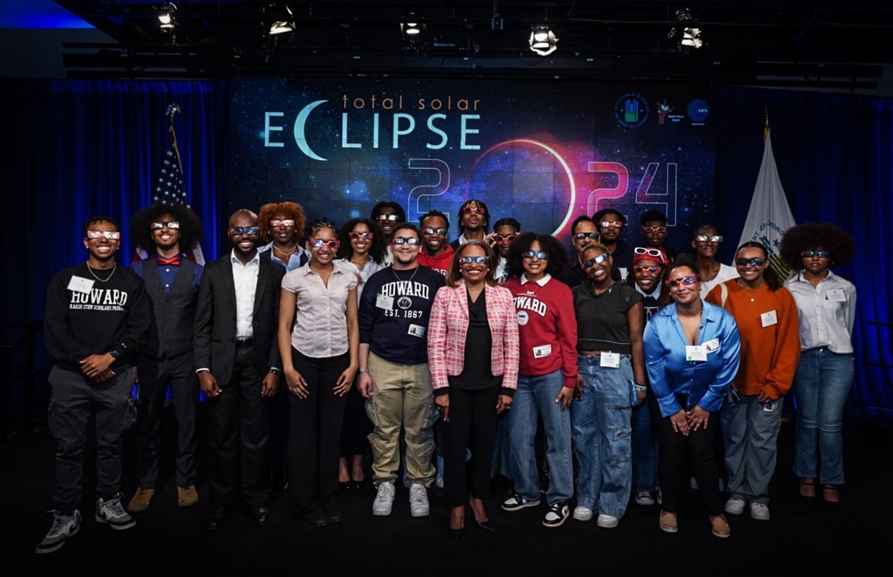 Acting Secretary Todman prepares to view the eclipse with students from Howard University's Society of Physics, equipped with safe eyewear from NASA.