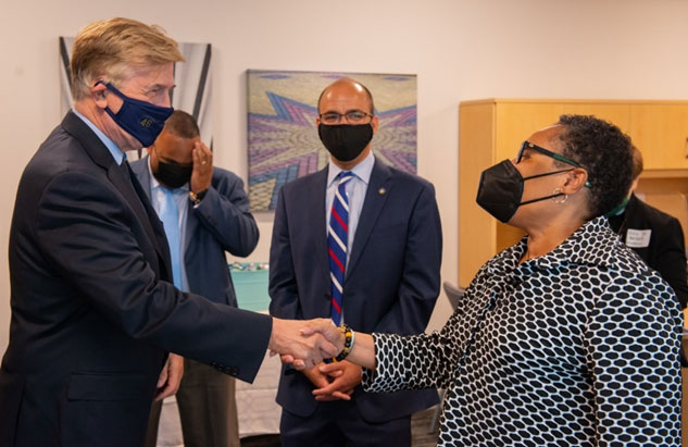 [Secretary Marcia L. Fudge shakes hands with U.S. Representative Don Beyer (VA-08) ahead of the Build Back Better event with City of Alexandria Mayor Justin Wilson (pictured center).]
