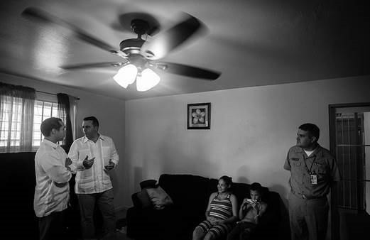 [HUD Secretary Julián Castro hears from Puerto Rico Housing Secretary Alberto Lastra about efforts to combat Zika virus in public housing while visiting with an expectant mother and her family. In February, the Obama Administration requested $1.9 billion in emergency funding from Congress to fight Zika. Photo by HUD Public Affairs.]