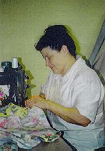 Photo of woman sewing