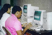 Photo of women working on computers